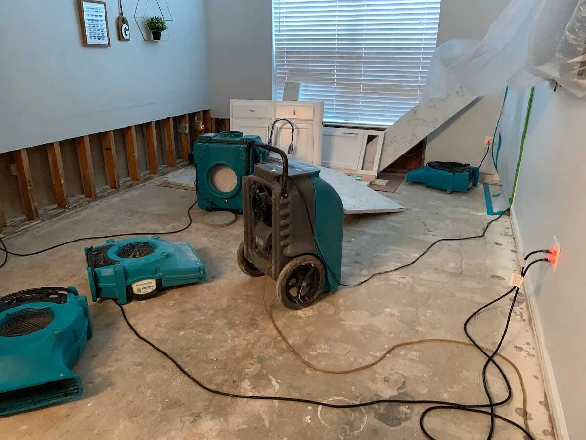 Dehumidifier in flood-cut room for Water Damage Restoration in Noble